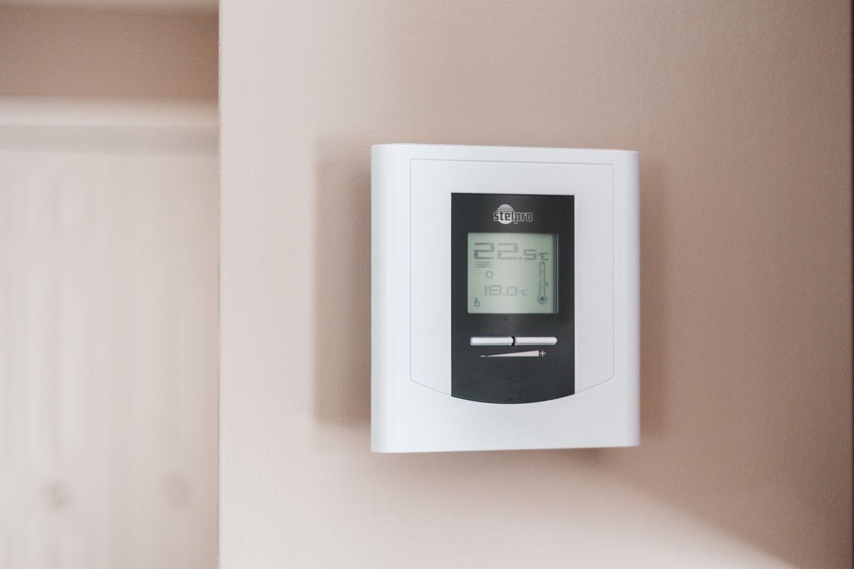 Invest in a programmable thermostat - drop by 1 degree to save